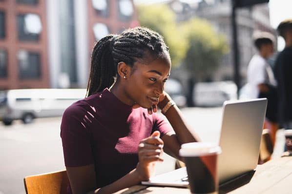 Data recovery for individuals: Happy customer behind laptop